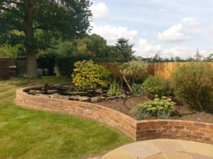 Bordered Pond, Lawn and Patio in Northampton